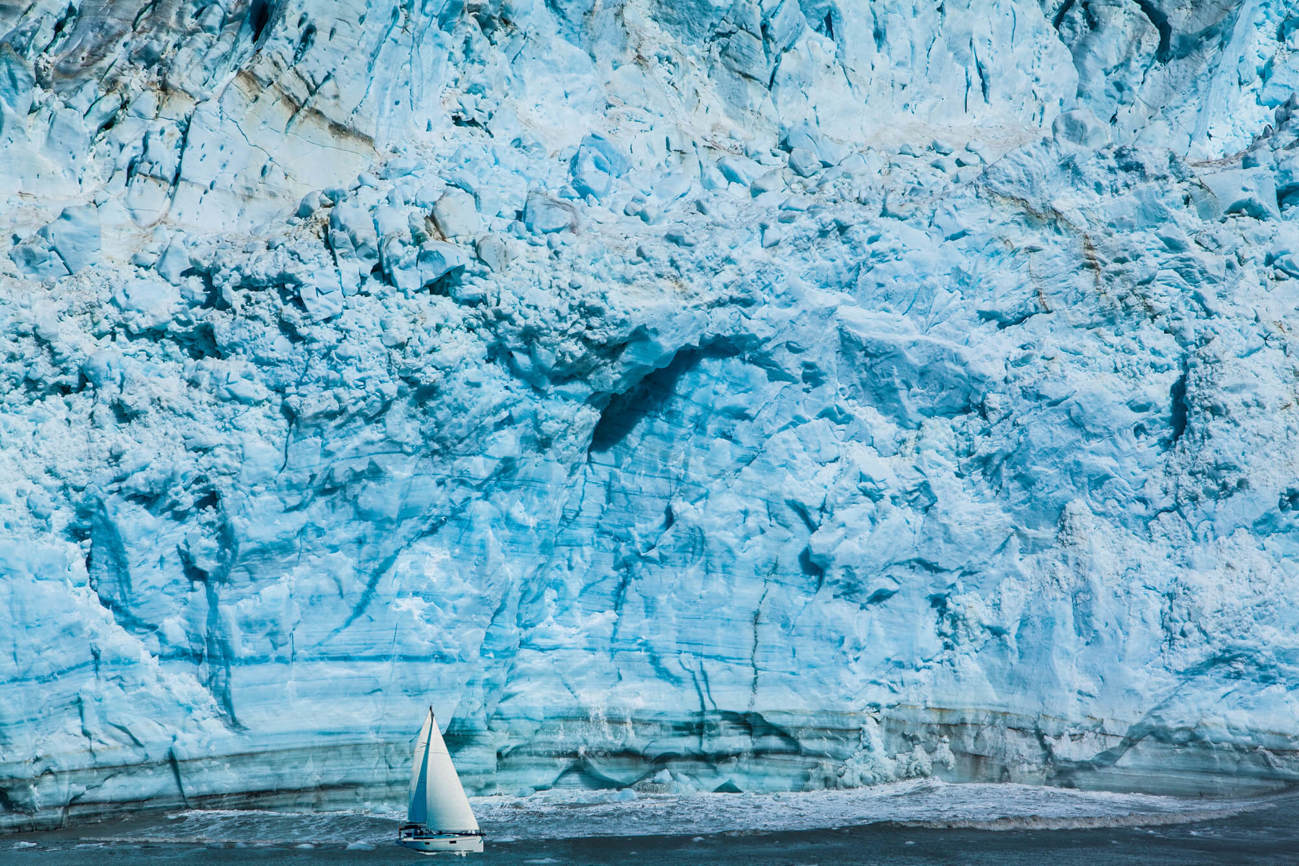 Wall of snow and ice at the Arctic with boat