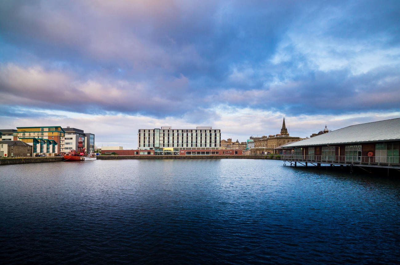 View of Apex City Quay Hotel & Spa from across the Quay