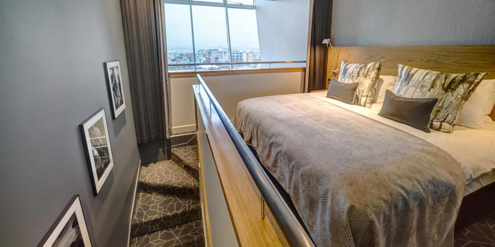 Duplex Suite bedroom upstairs with double bed at Apex City of Glasgow Hotel