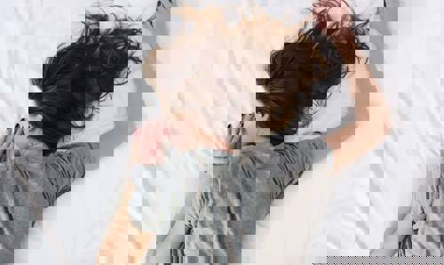 Woman sleeping on a bed