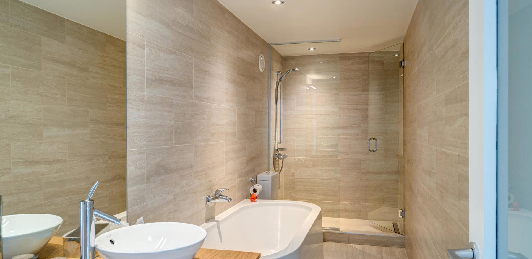 Junior Suite bathroom with tub and walk-in shower