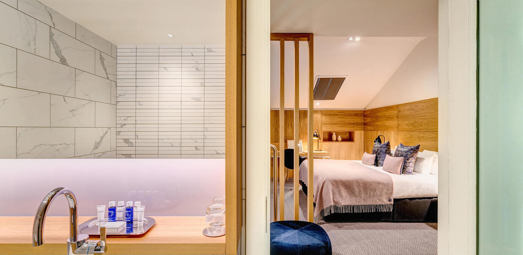 Bathroom and upstairs bedroom area in Duplex Suite at Apex Waterloo Place Hotel