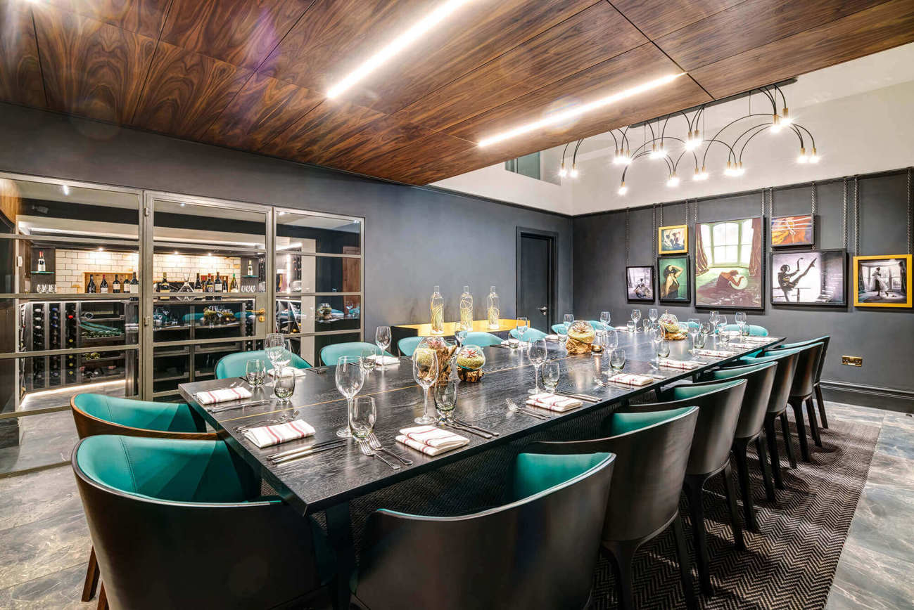 The Liberality Room with wine cellar and table set boardroom style for private dining at Lazy Ballerinas