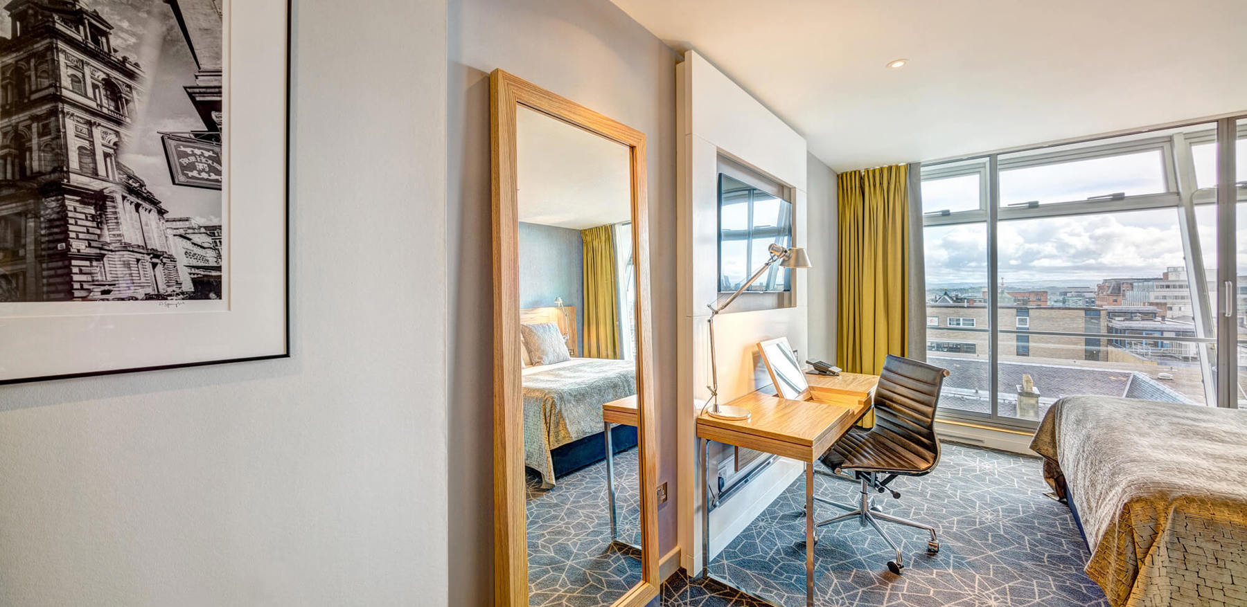 City View Room with bed, TV and desk