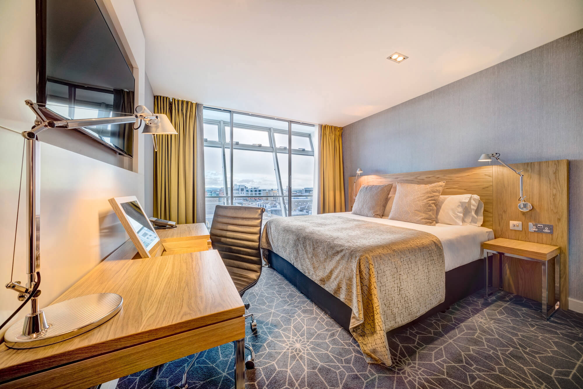 City view room with King size bed, desk, TV at Apex City of Glasgow Hotel