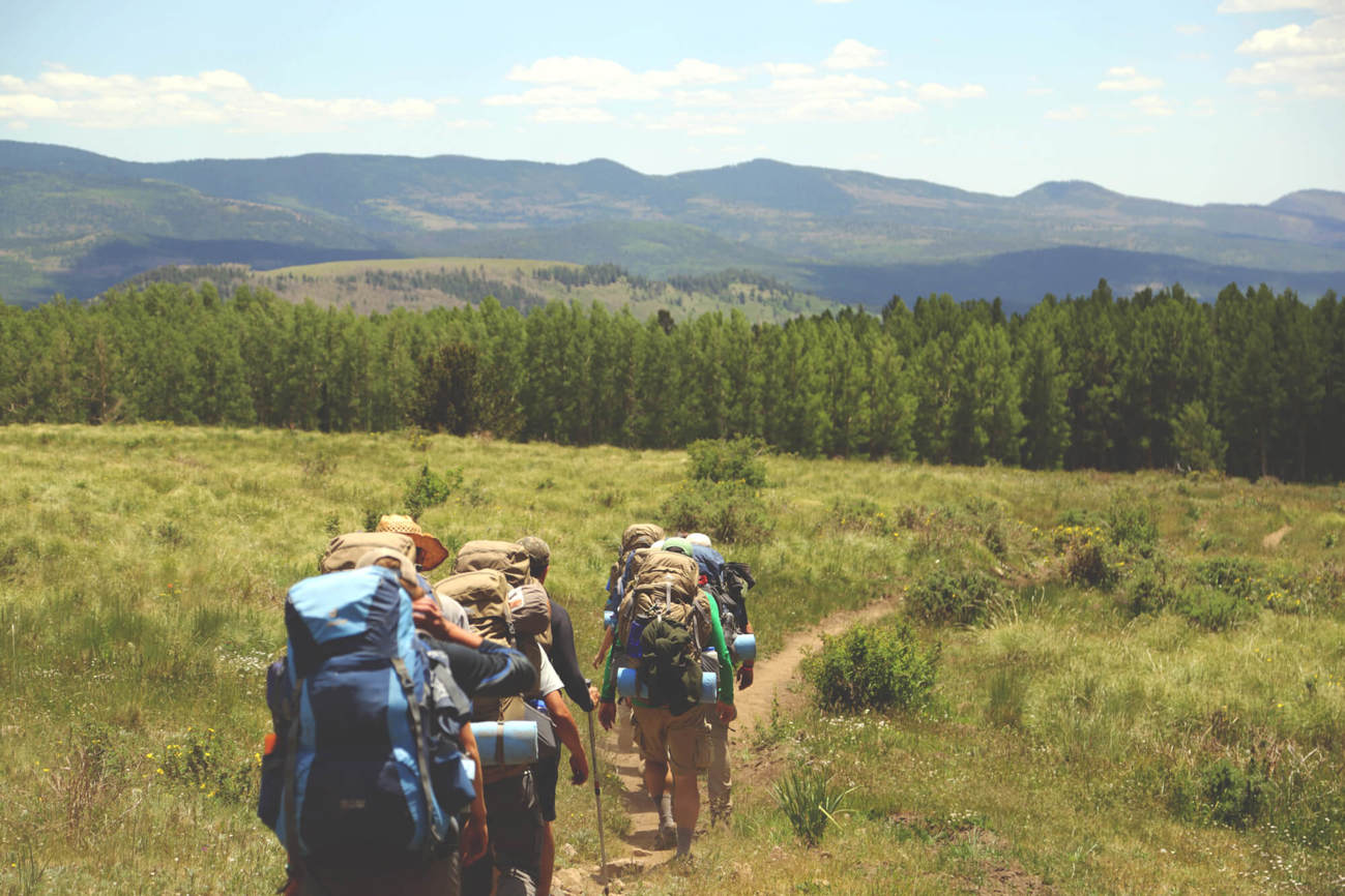 Group of friends hiking outdoors in Scotland