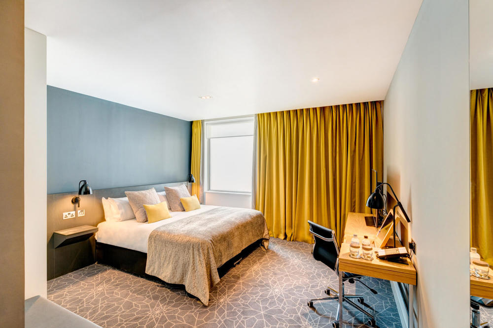 City Room with king-size bed and desk with TV