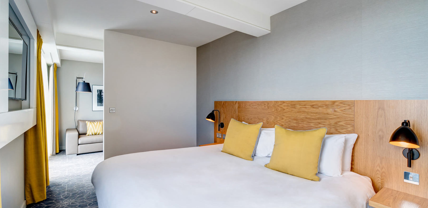 Junior Suite bedroom with king-size bed and TV