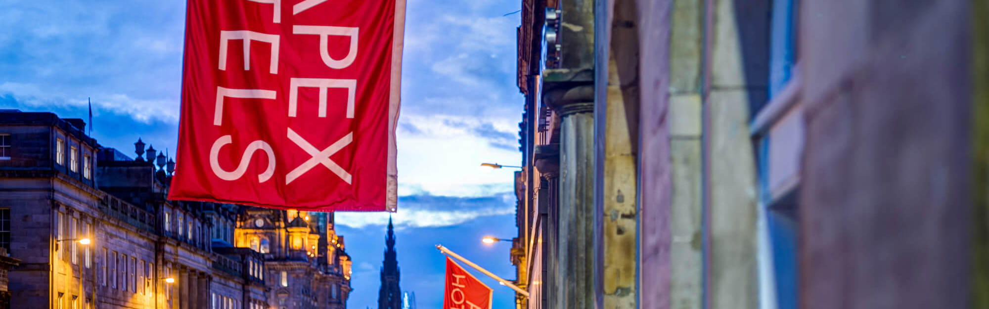 Exterior of Apex Waterloo Place Hotel with red Apex Hotels flag