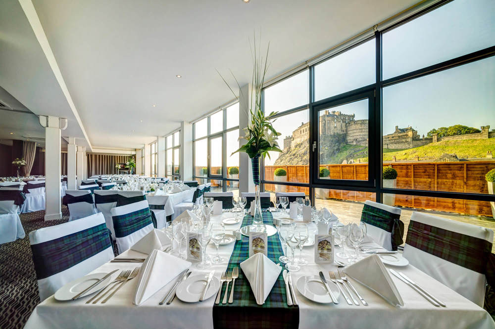 Heights restaurant with tables dressed for an event and views looking onto Edinburgh Castle