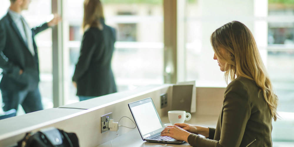 Female business traveller on laptop