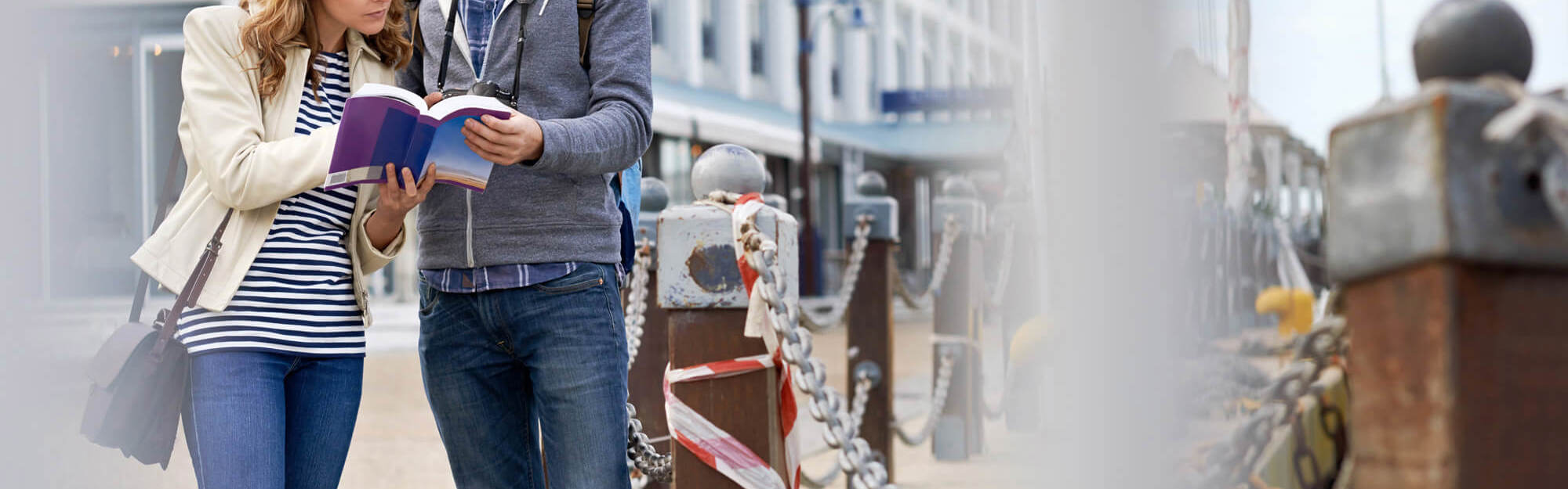 Tourist couple looking at map