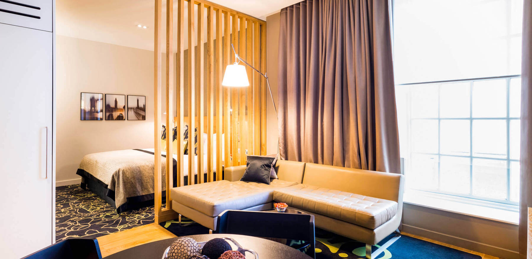 Living area with sofa in Junior Suite at Apex Temple Court Hotel