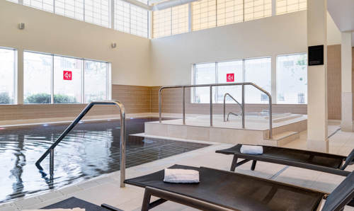 Yu Spa swimming pool with poolside loungers