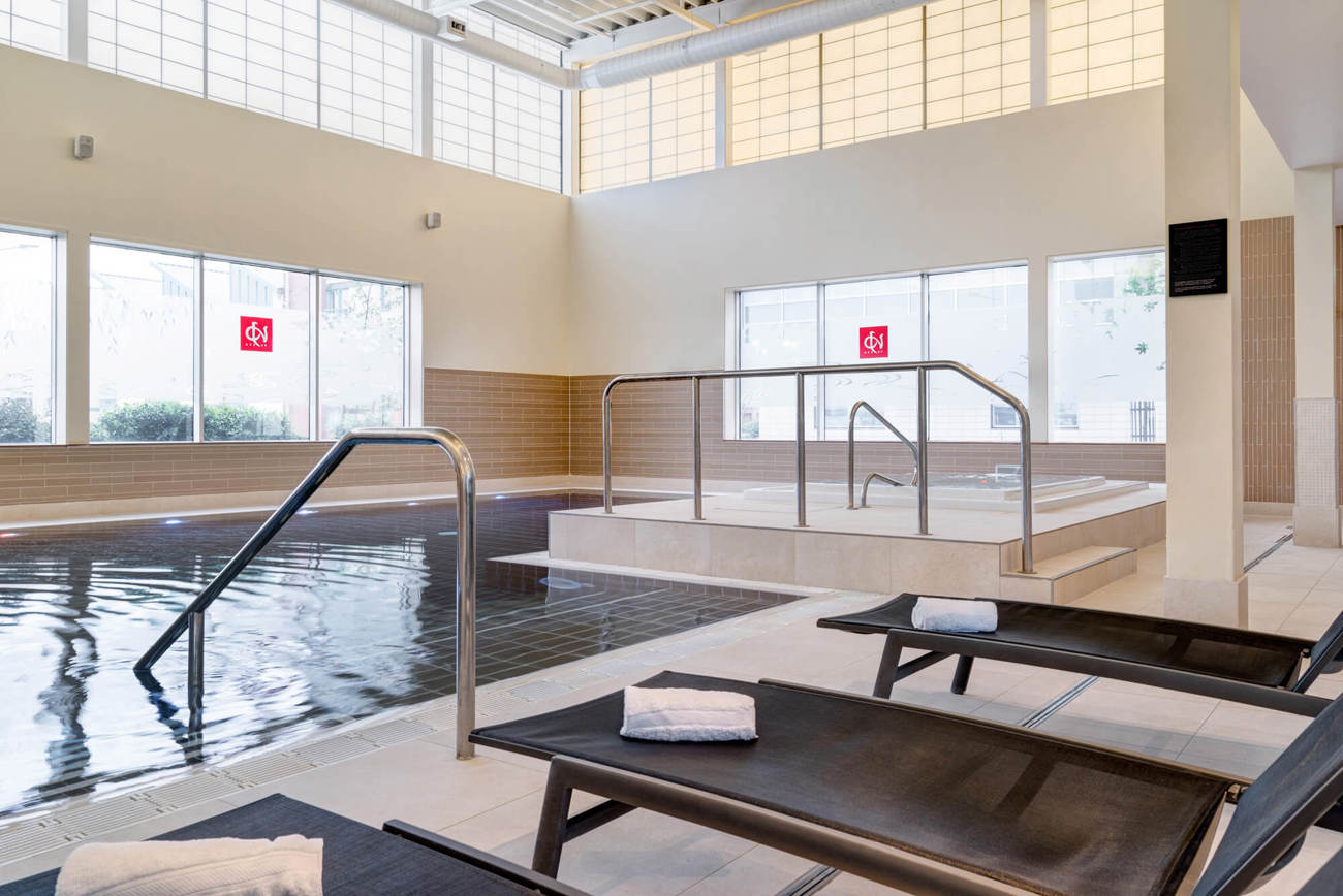 Swimming pool with poolside loungers at Yu Spa, Dundee