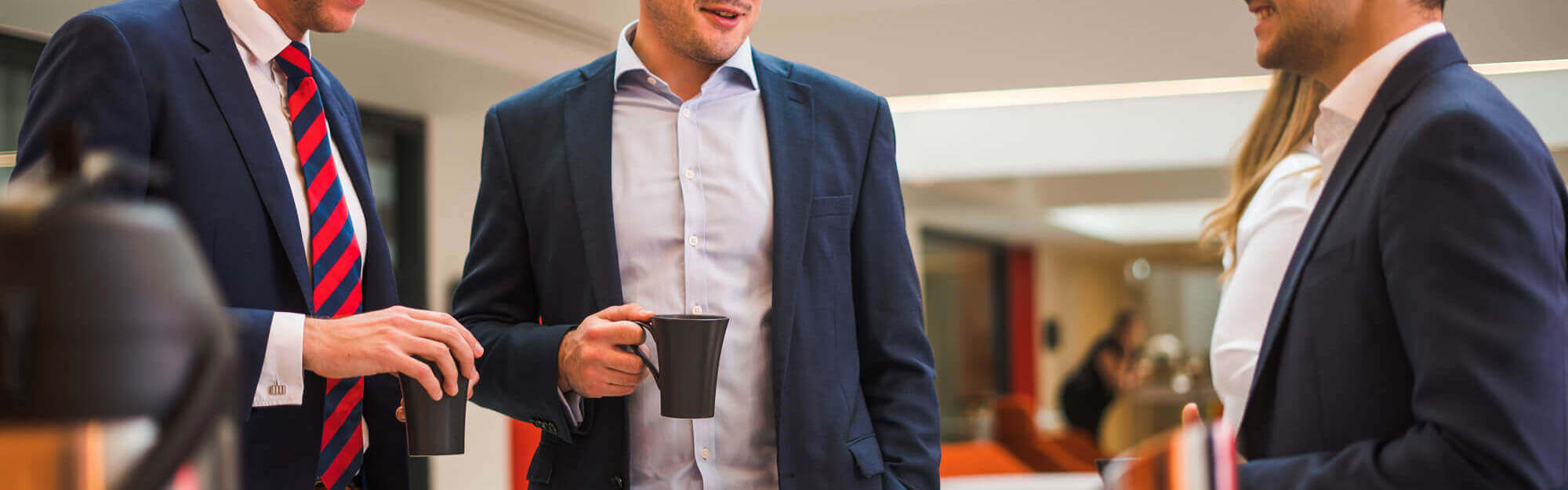 Colleagues chatting over coffee at Apex City of Bath Hotel