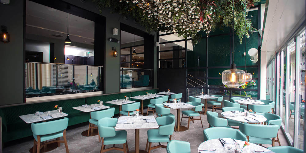 The Lampery restaurant at Apex City of London Hotel set up for dining with tables and chairs