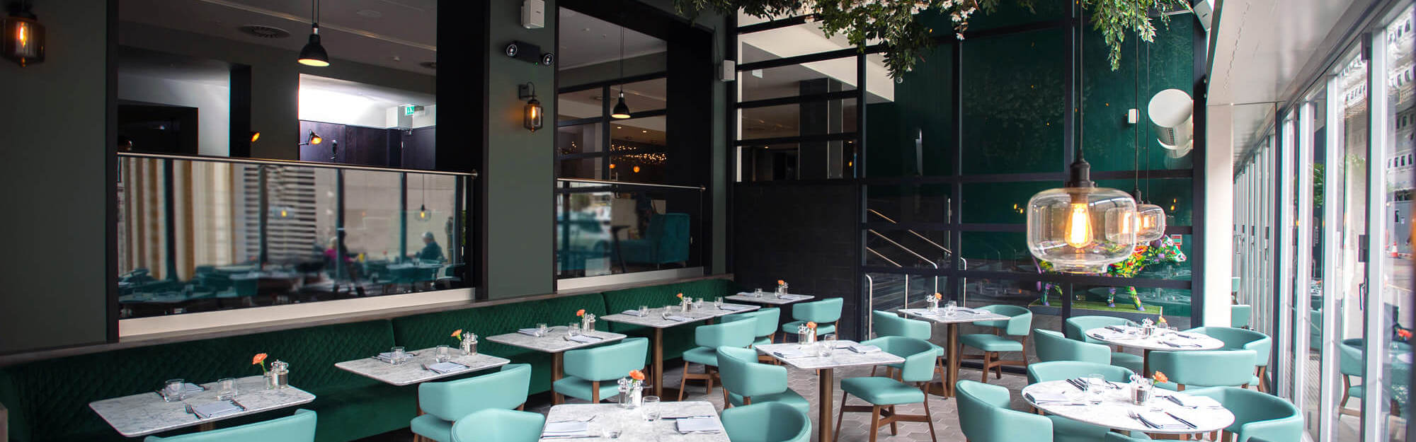 The Lampery restaurant at Apex City of London Hotel set up for dining with tables and chairs